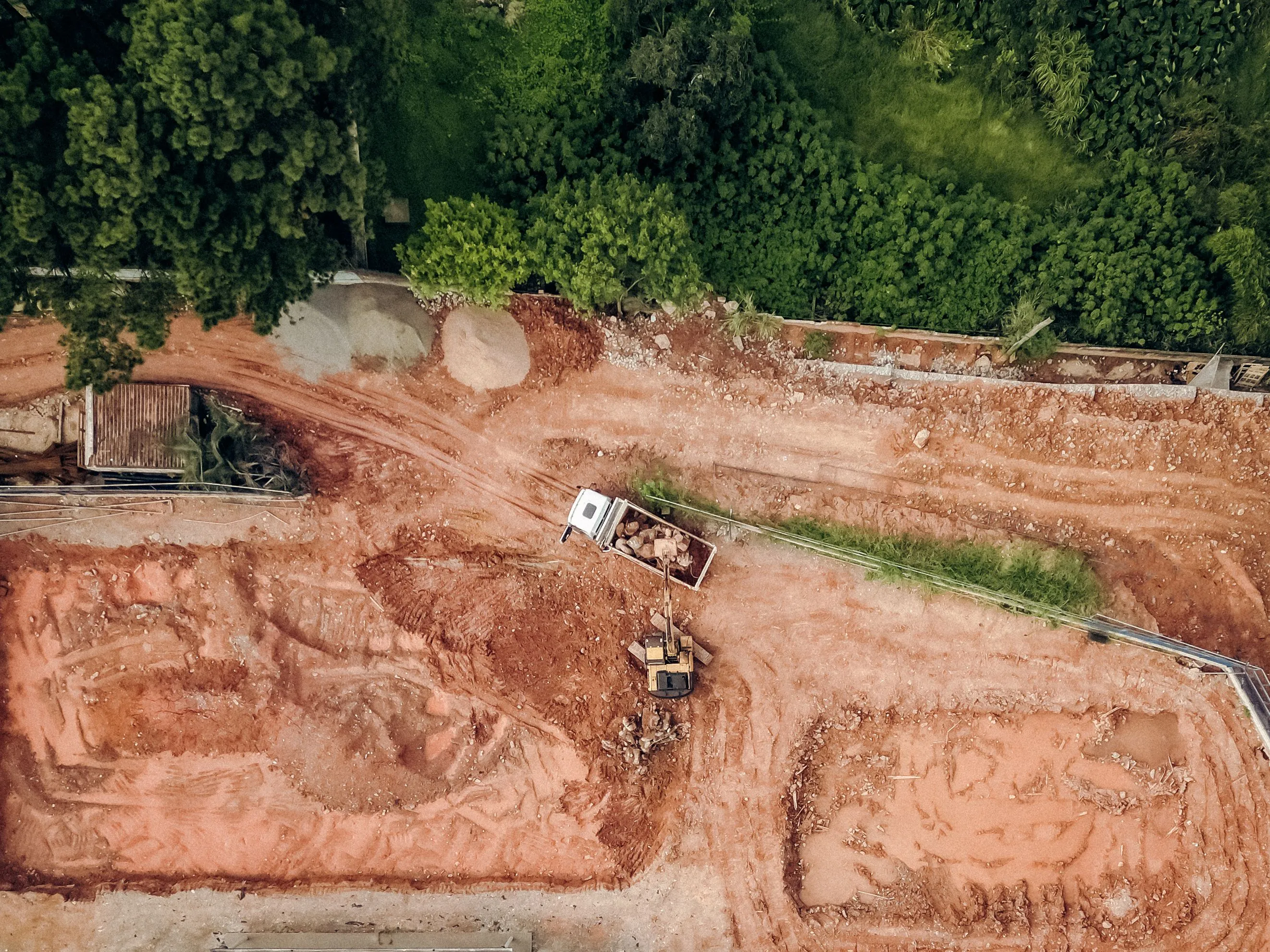 Aerial view of a cleared and graded construction site ready for site work